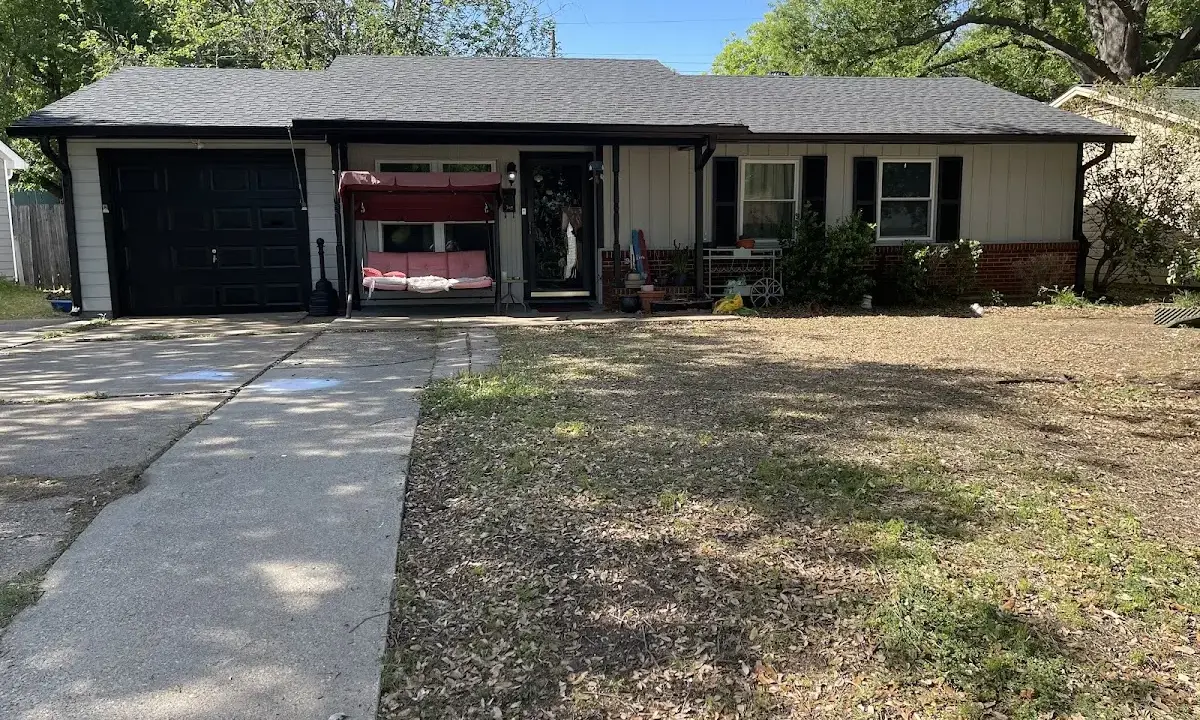 Asphalt Shingle Roof Repair crew at work on a residential roof in Covington